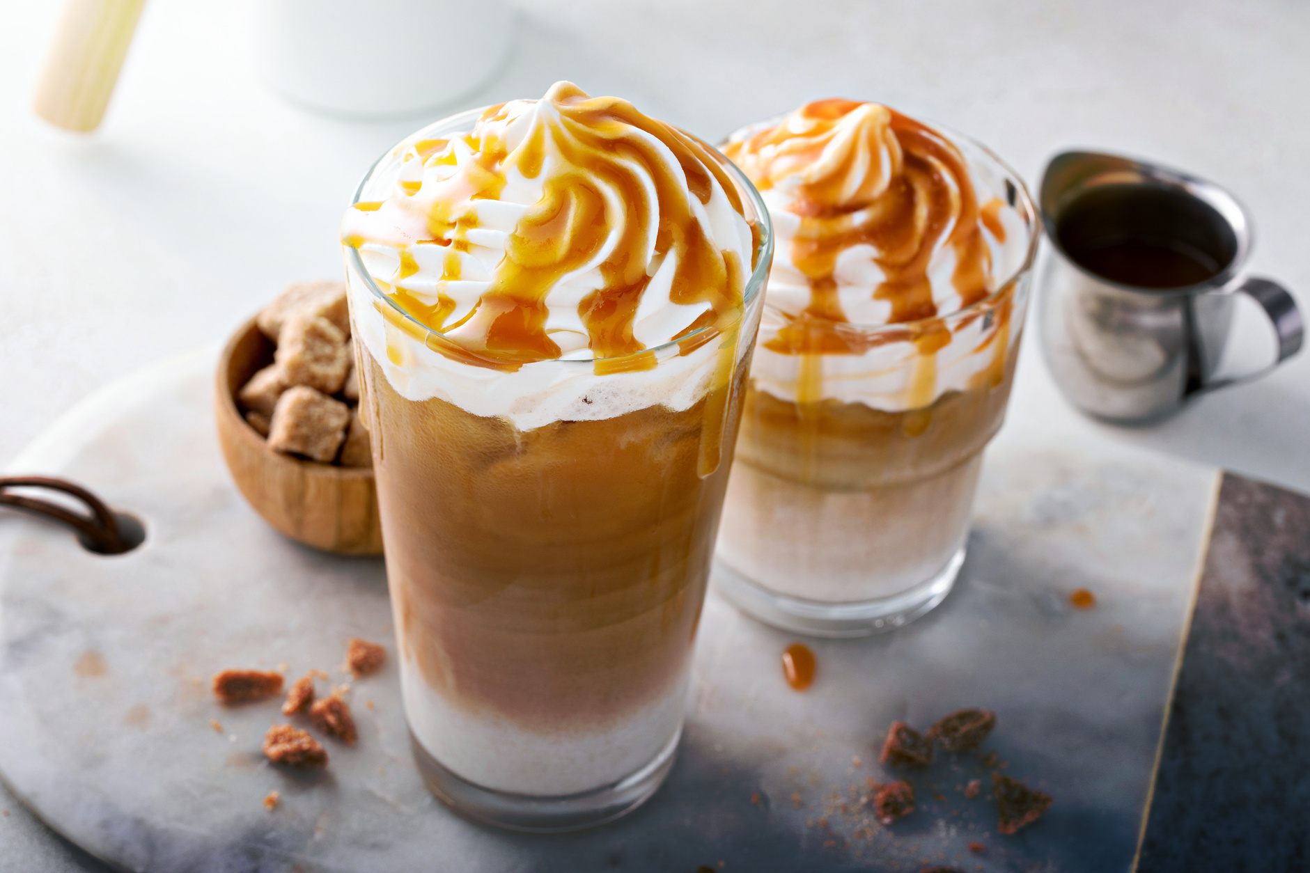 Iced Caramel Latte Topped with Whipped Cream and Caramel Sauce